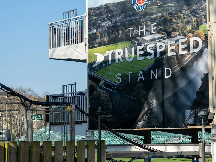 Large outdoor vinyl banner installed at an event entrance